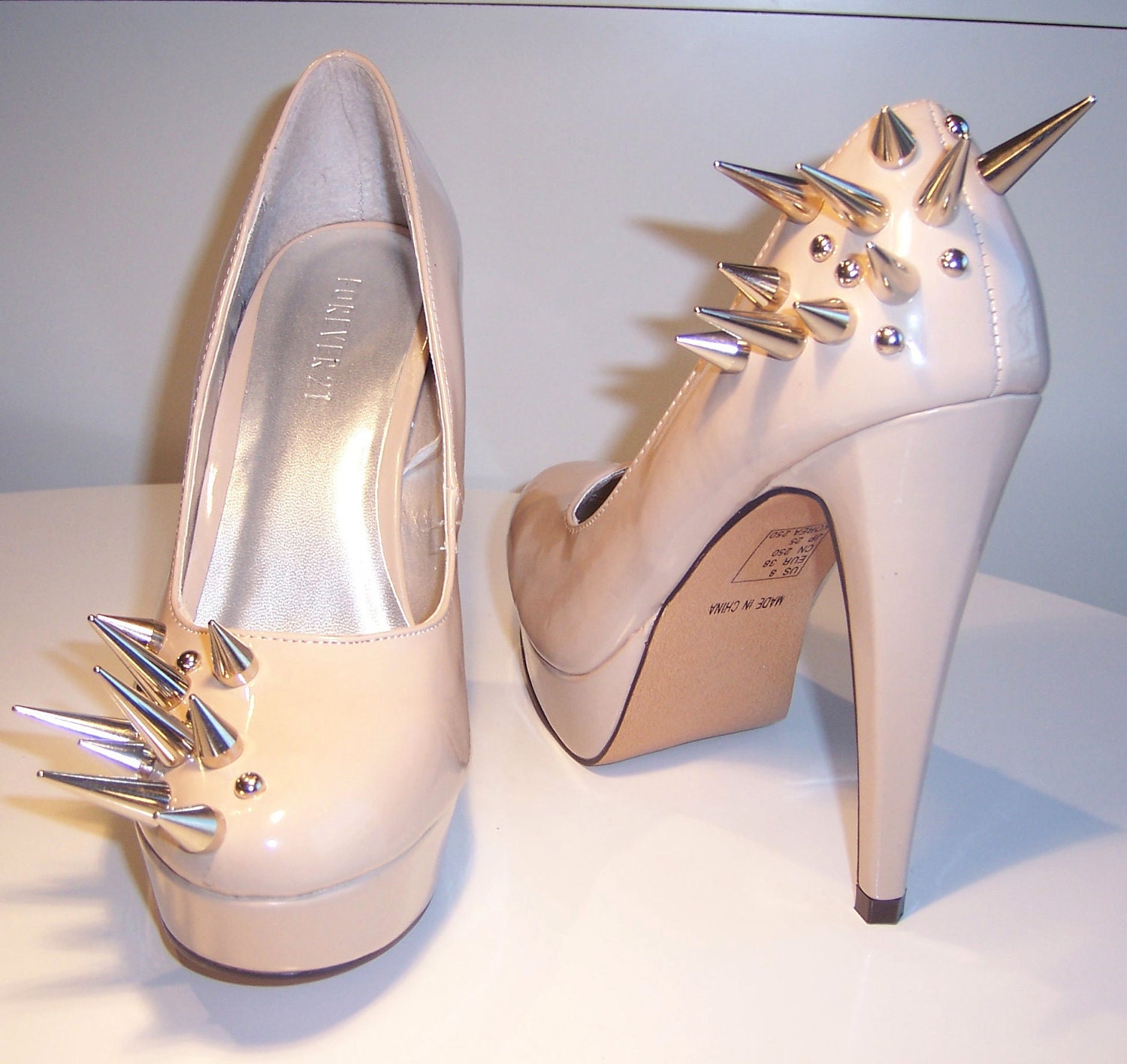 Asymmetrical Spiked Patent Leather Pumps - Nude
