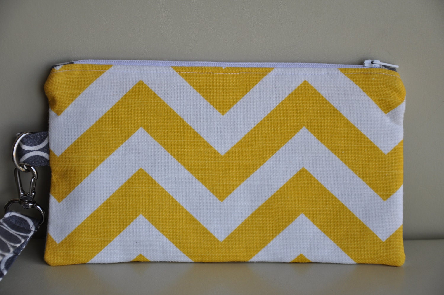 wristlet clutch with gathers and zipper, credit card pockets, removable strap