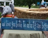 wooden sign with vinyl lettering - we love you both to infinity and beyond