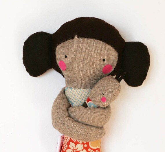 Mother carrying baby with a foulard