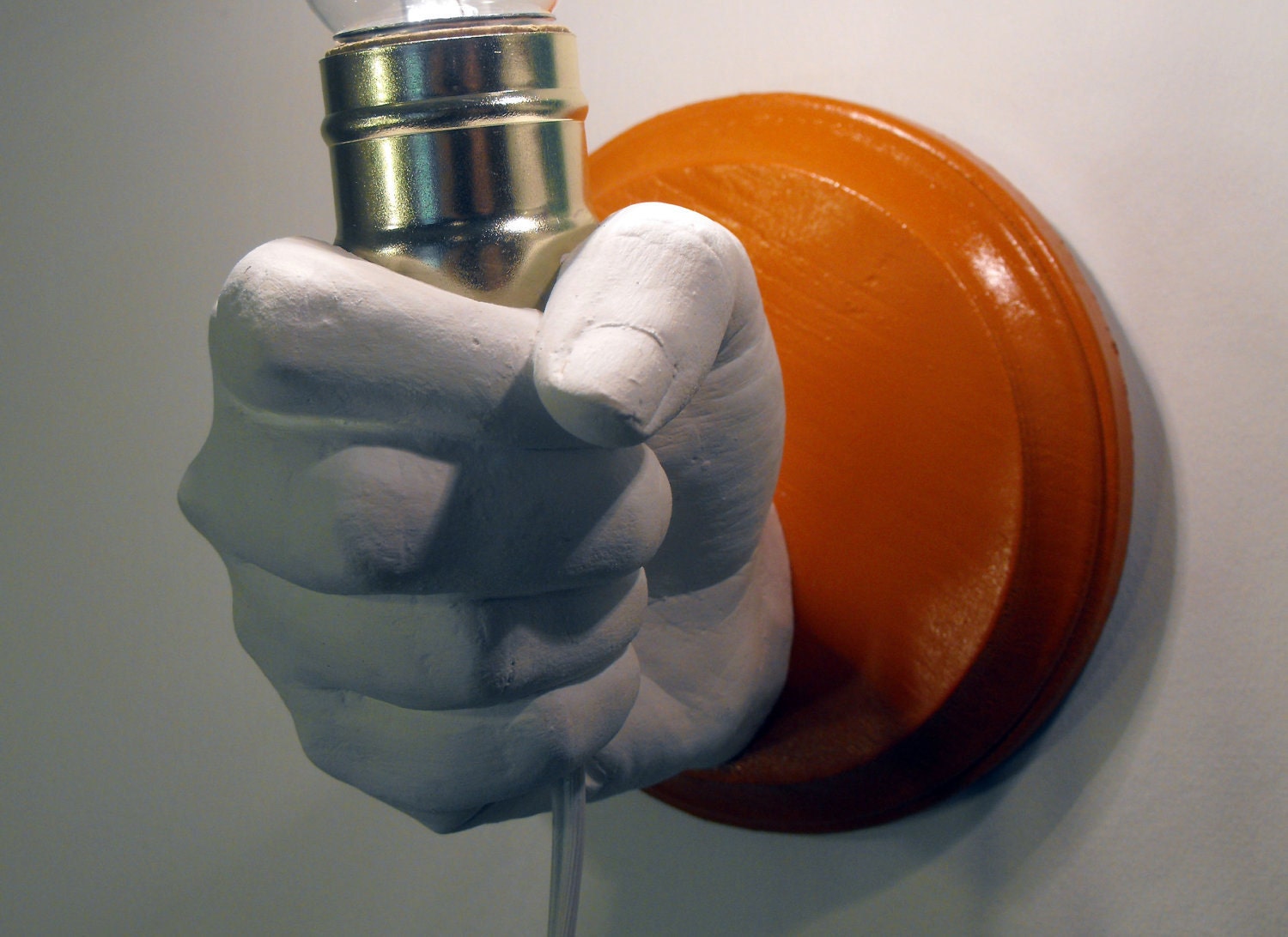 Hand Holding Bulb Wall Lamp (Red)