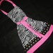 Classy retro black, white zebra print with pink apron and reversible to a flirtatious polka dot print for women and teens