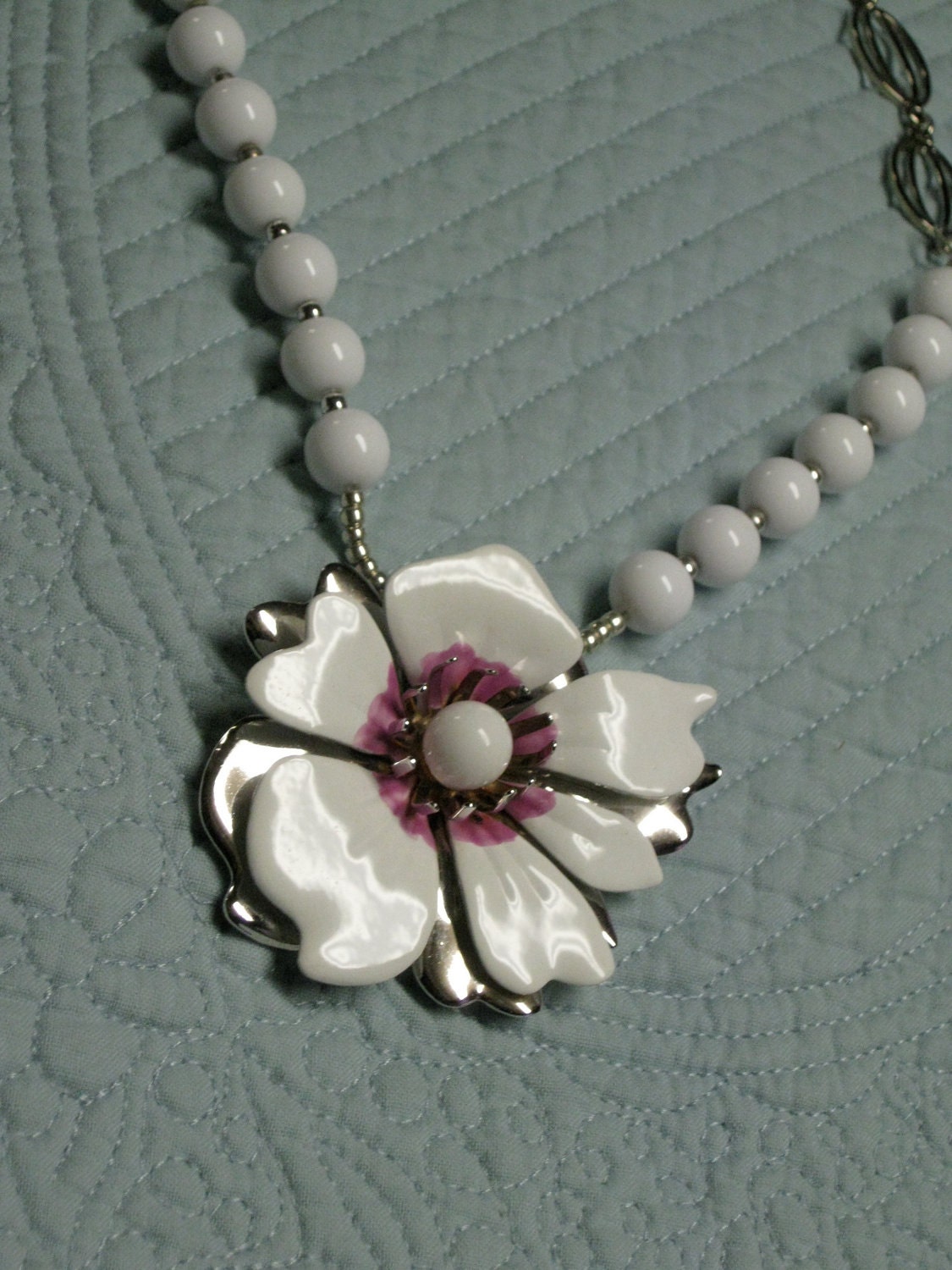 Silver and white necklace with a touch of Magenta