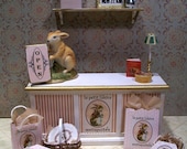 Beautifully detailed 1:12 scale dollhouse miniature Le Petit Lievre Antiquites - Little Rabbit Antiques -  shop counter and accessories