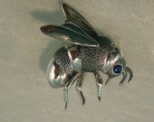 silver bee pin with blue sapphire eye