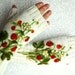 White fingerless gloves with felted strawberries
