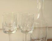 Crystal decanter set.   INCLUDES four matching wine glasses AND gorgeous finial.