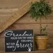 Grandmas hold our tiny hands for a little while, but our hearts forever sign