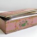 Dusky pink vintage tin box with art deco flowers, New York