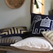 Doha in Metallic gold hand printed on navy blue organic hemp pillow cover 12x21