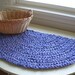 half moon crocheted rag rug or table mat, upcycled lavender fabric