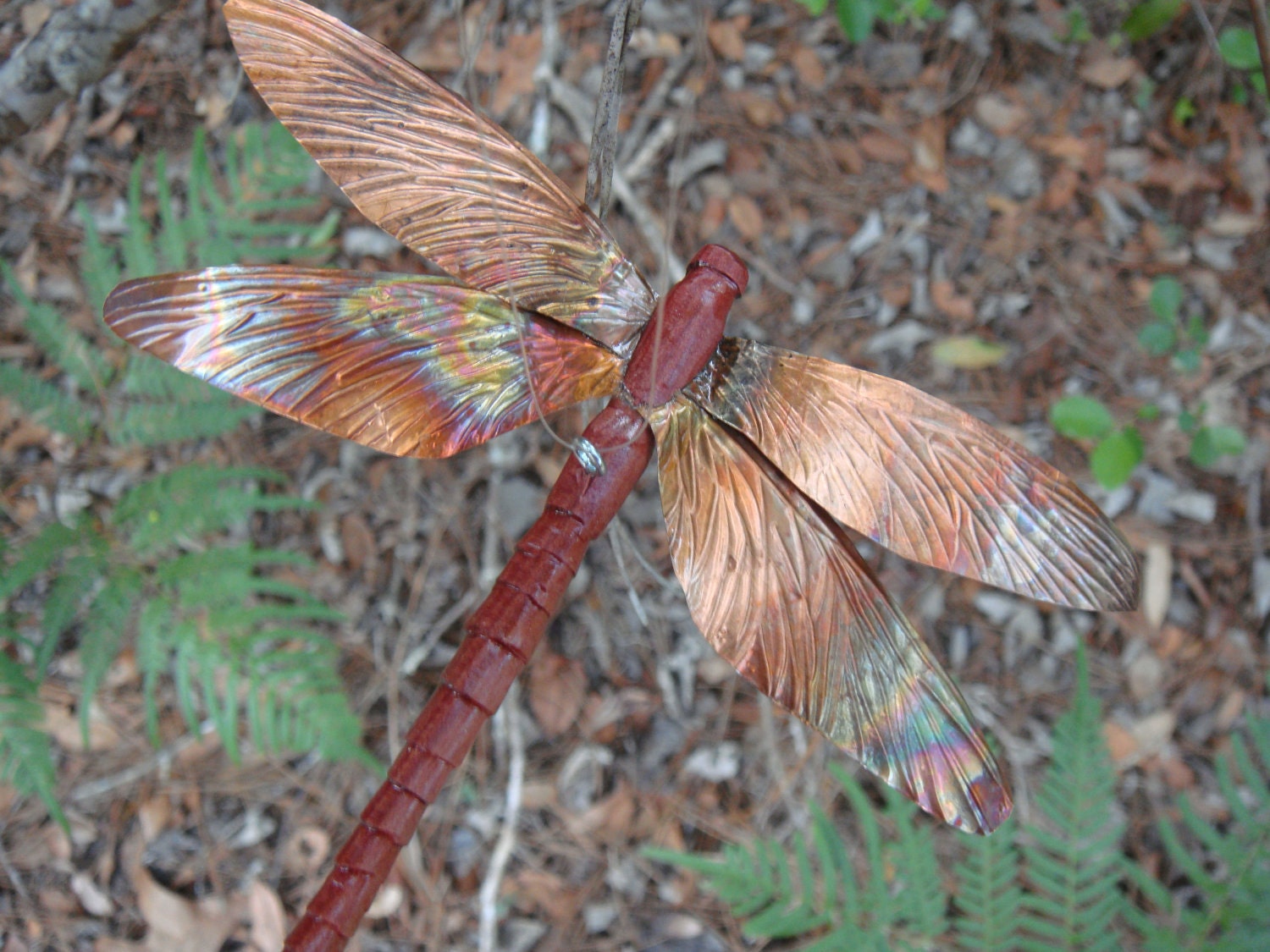 carved cedar wood and copper dragonfly