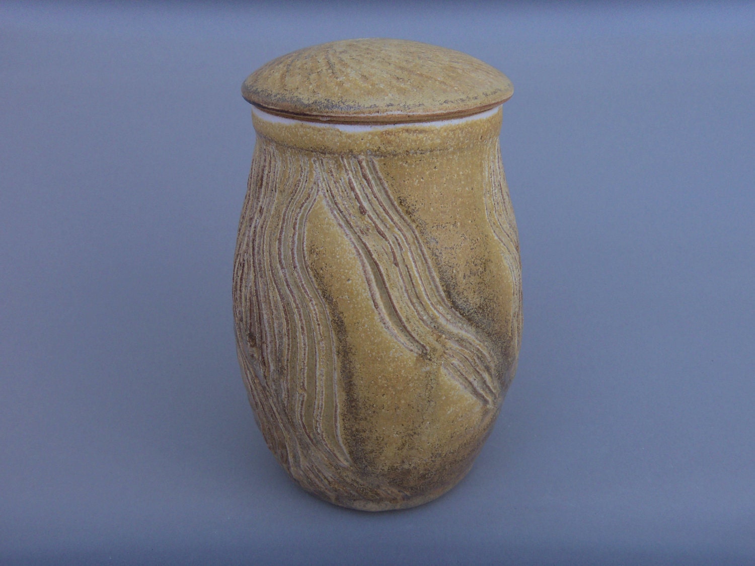 Primitive Nutmeg Colored Carved Stoneware jar