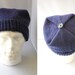 Hand knitted men's square, envelope style hat.