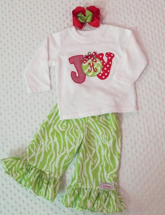 Girls Christmas outfit with ruffle pants and matching appliqued shirt with monogram in the ornament