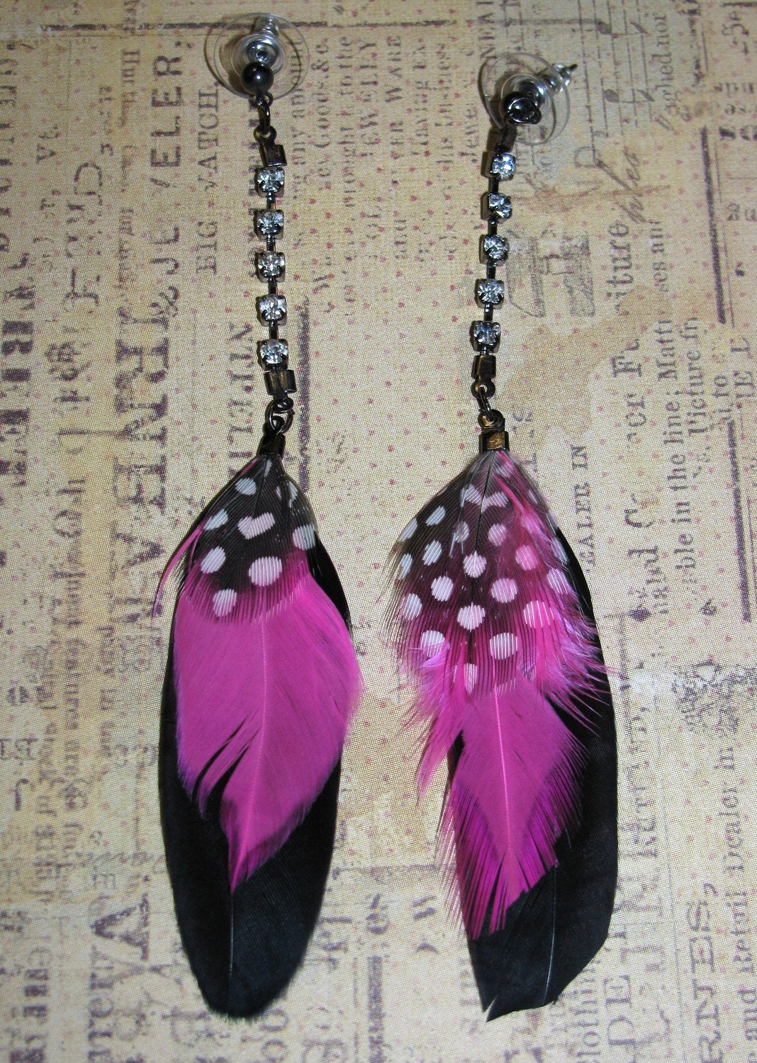 Items similar to 80s style feather earrings on Etsy