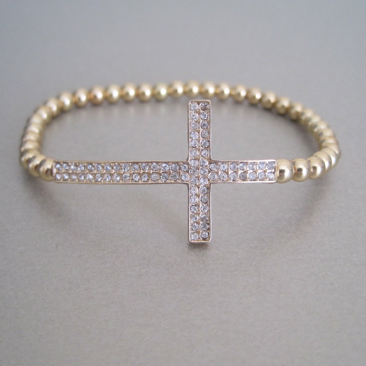 Sideways CZ Gold Cross Bracelet