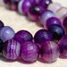10mm Purple Striped Agate Faceted Round -7.5 inch strand