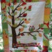 Owl baby quilt of flannel cotton in red blue green yellow orange fabrics with tree, leaves and 1 owl