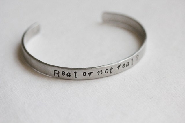 Hunger Games Real or Not Real hidden message cuff