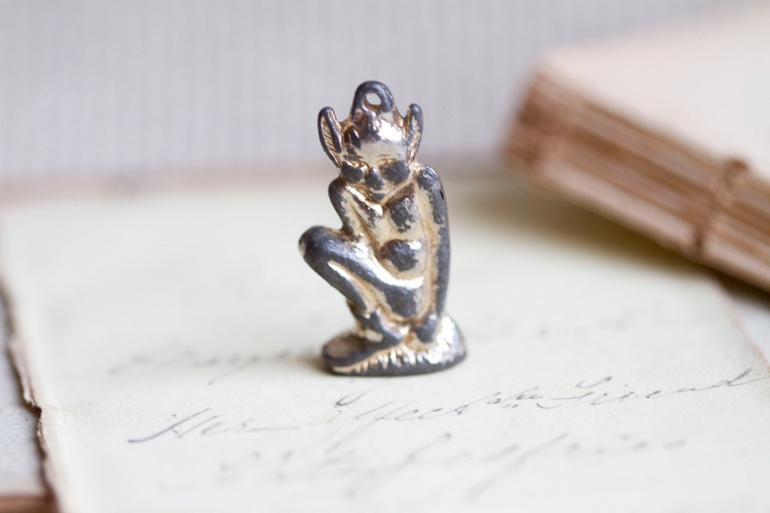 Distressed little Pixie Sitting on a Mushroom Charm figure