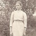 Vintage Photo - Pretty Girl in Simple Long Dress, Apron Front, Locket Necklace, Hair Loosely Pulled Back - c. 1920s Europe RPPC