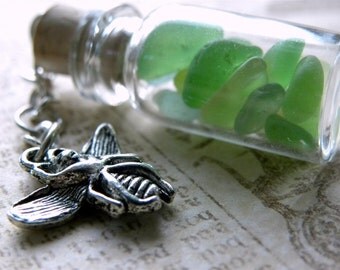Green sea glass in a tiny bottle with bee charm