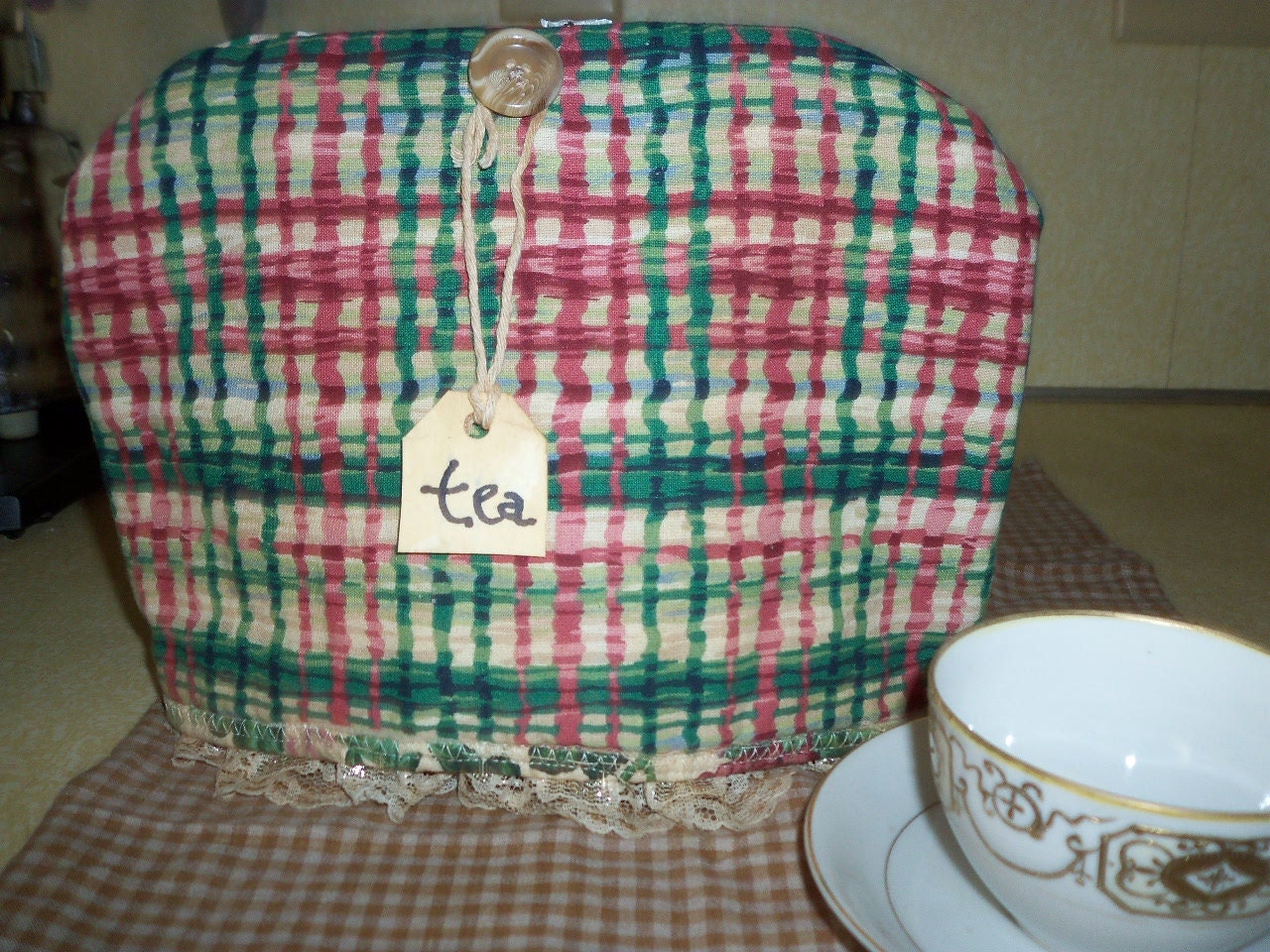 Reversible holiday plaid and ivy floral print tea cozy