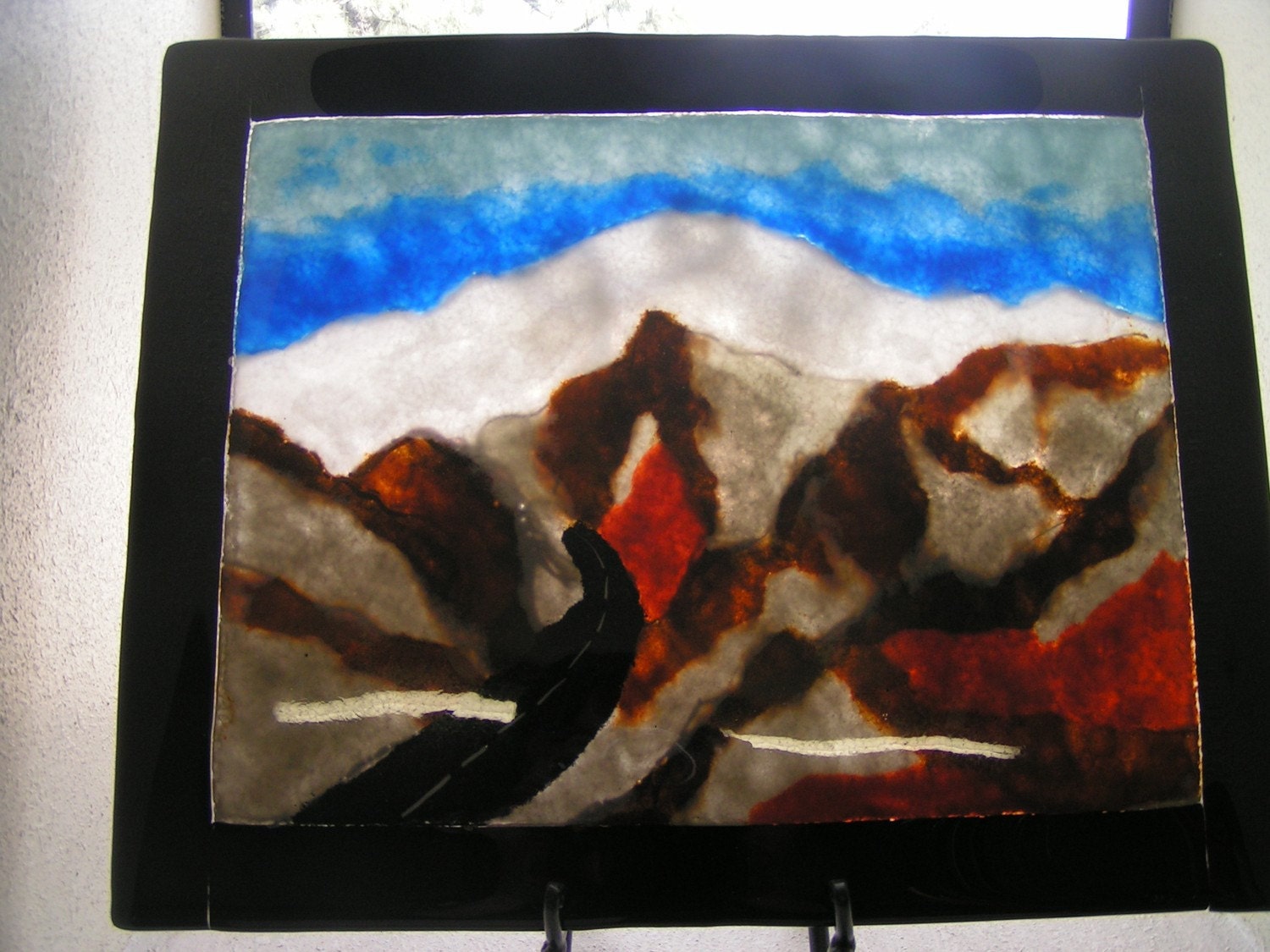 Painting in glass frit of Mt Baldy with snow