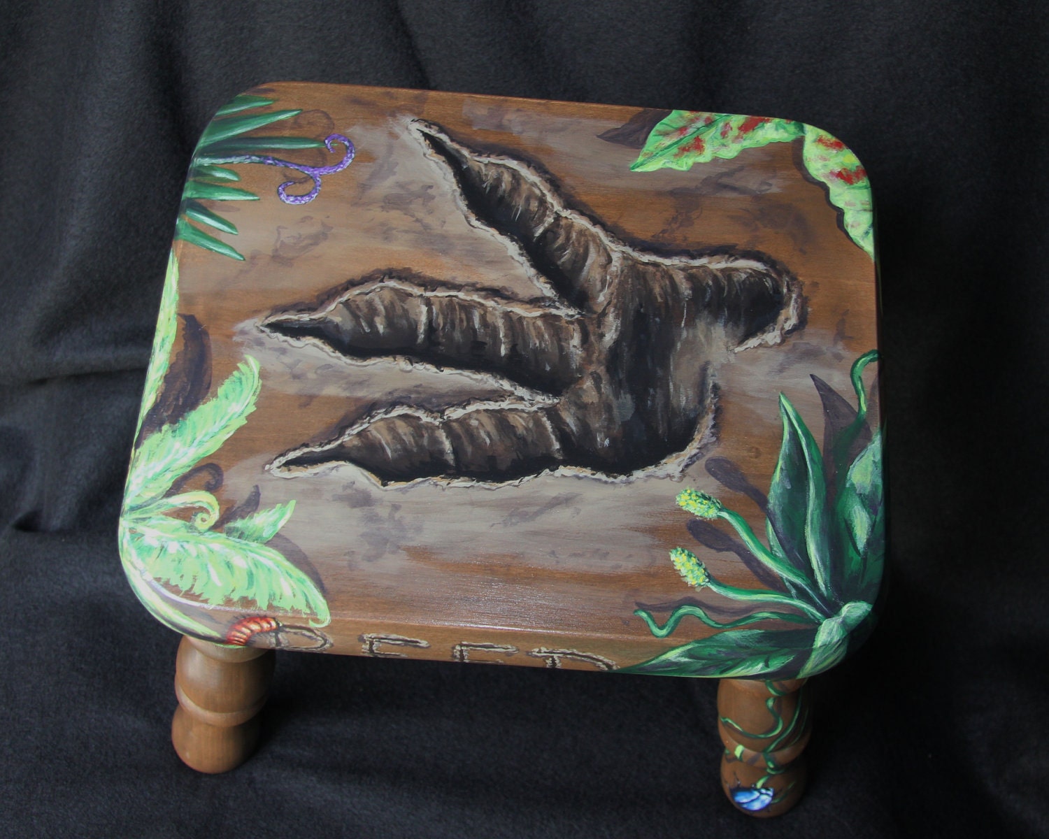 Handpainted dinosaur footprint child's footstool