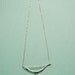 Silver bow and arrow necklace