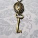 Vintage Styled Key Pendant in Antiqued Brass with Amber Colored Glass Beads