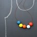 not quite round handmade beads make a necklace