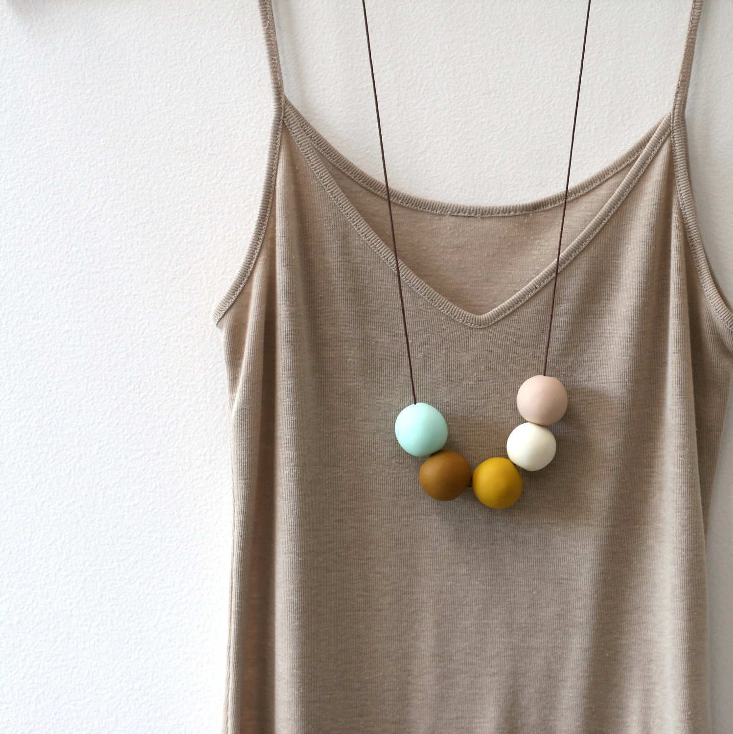 not quite round handmade beads make a necklace