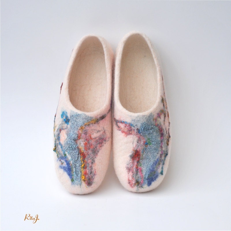 Felted slippers from natural white wool, shiny