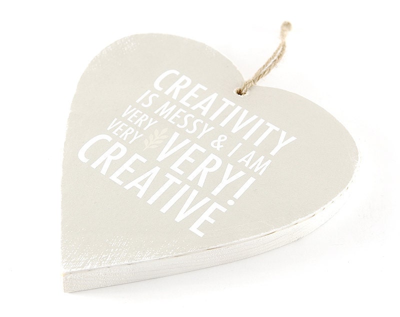 Creativity is Messy Wooden Hanging Heart. Minimal Pale Neutral Home Decor in Cream and White. Simple beige heart.