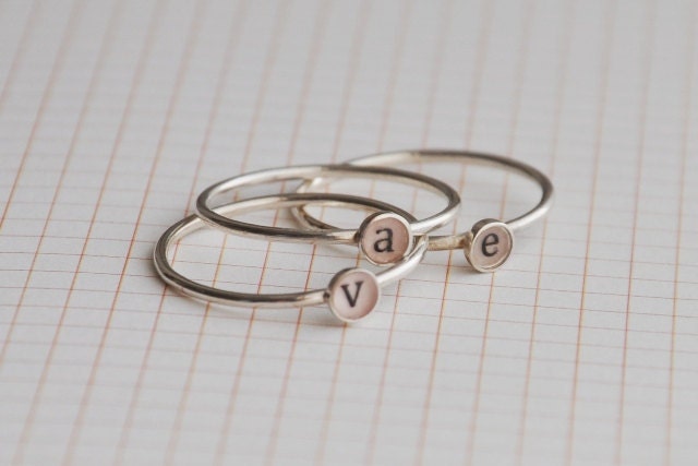 Set of three lowercase initial rings , sterling silver