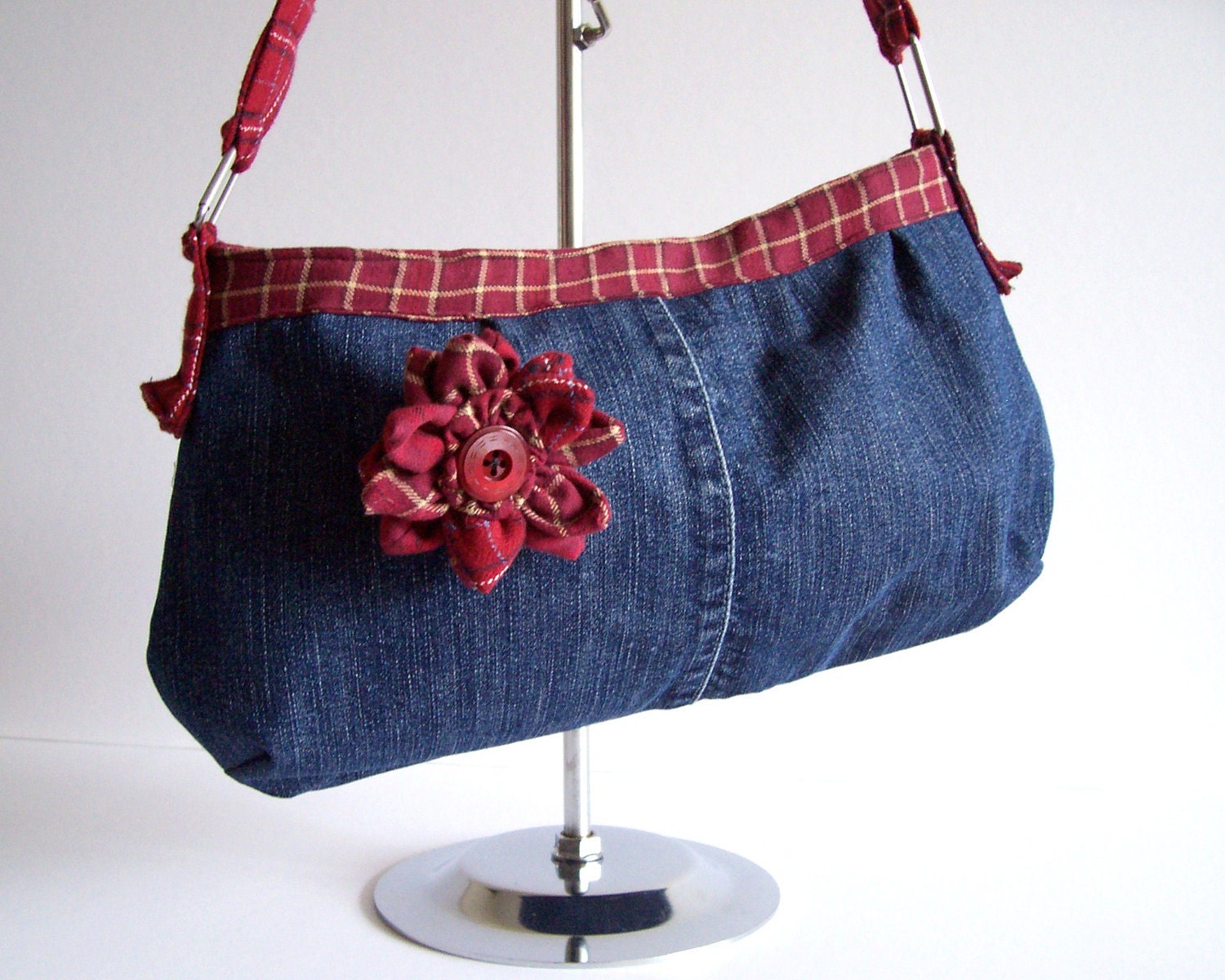 Recycled denim shoulder bag with flower brooch red plaid trim, plaited handle