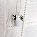 White kitten in a mug pendant - the cat and the rosebuds