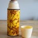 Thermos, retro style with yellow flower pattern