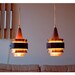 Danish lamps. Copper, black matte iron and teak hanging lamps, set of 2. Mid-century. 1960s