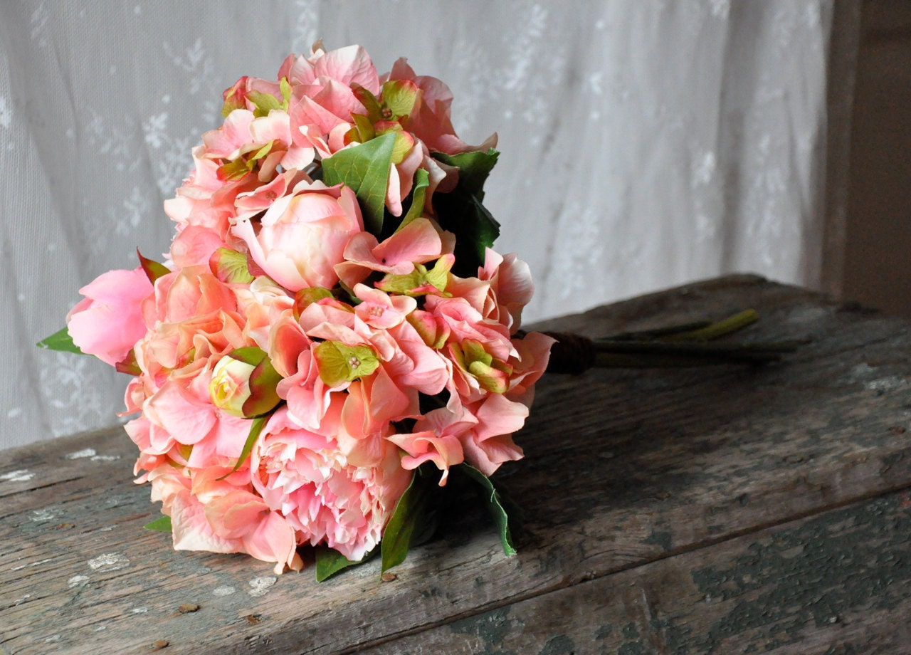 Pink peony and hydrangea wedding bouquet.
