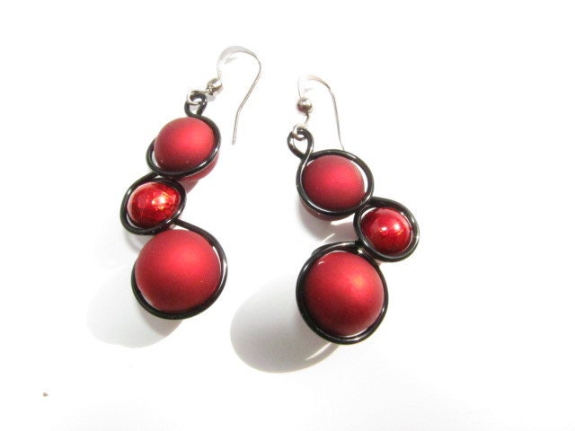 Red Rubber Balls and black wire wrapped earrings also with wine red metallic beads, black wire and french ear wires.