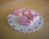 Miniature heart shaped frosted cookies