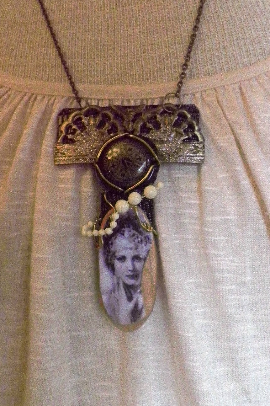 Assemblage mixed media necklace with champaign lid and cage wrapped around lady pendant