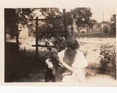 Vintage/Antique  photo of a woman in a dress with her dog