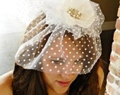 Couture bridal veil headpiece in white with rhinestone focal point