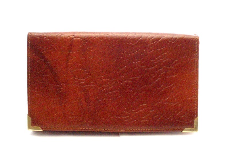 Vintage, Amber Brown Leather Wallet/Purse with goldtone edges on the front.