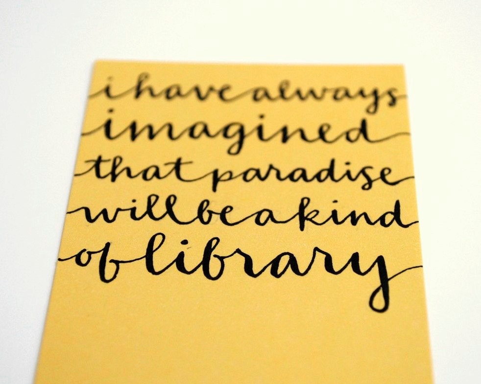 Yellow Bookmark with Handwritten Calligraphy . I Have Always Imagined That Paradise Will Be a Kind of Library