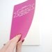 Idea Notebook with Banner and Modern Calligraphy . Large Moleskine Volant . Hot Pink . Amazing Ideas That Will Change the World